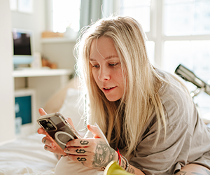 Image of a youth looking at phone